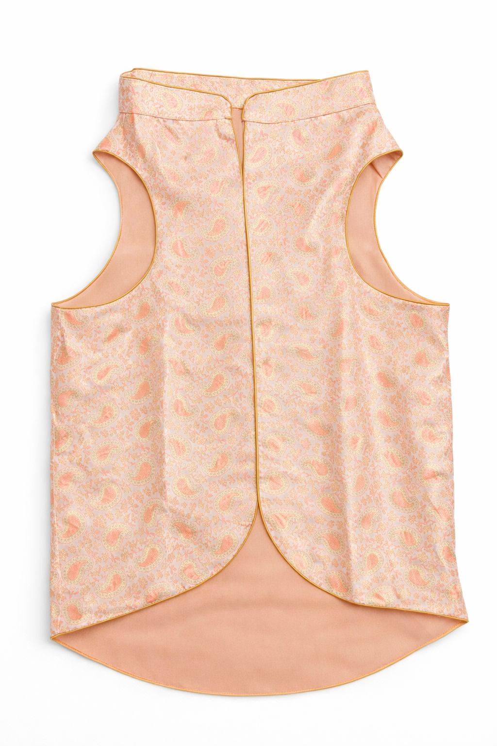 Light pink sleeveless top with subtle pattern on a white background