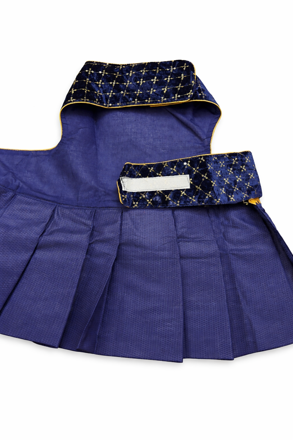 Blue pleated garment with decorative trim on a white background