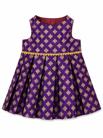 Purple dress with gold patterns on a white background