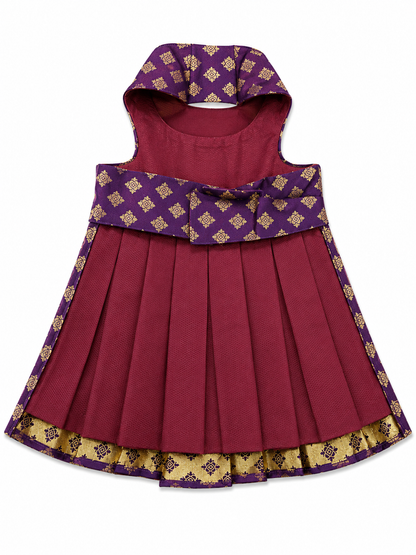 Red dress with purple hood and gold patterns on a white background