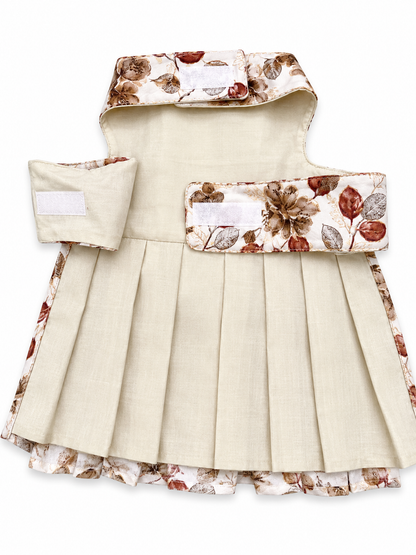 Children's dress with floral hood and trim on a white background